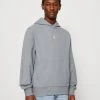 Calvin Klein Jeans Micro Monologo Hoodie Unisex - Hoodie - Overcast Grey -Gant shop 6dd7b9219a034782b415bd5a435cf5ed