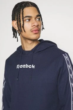 Reebok Ri Vector Tape Oth- Hoodie - Vector Navy -Gant shop 9c538e838d2948768b91615eadde3e56 scaled