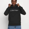 Calvin Klein Core Logo Hoodie - Hoodie - Black -Gant shop ca682396fe1f40009d9e33329a8169d0