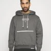 Nike Performance Liverpool Fc Standard Issue Hoodie - Sweatshirt - Charcoal Heather/Pale Ivory -Gant shop ea18614f79d4483ebb47a552e3dafc2f